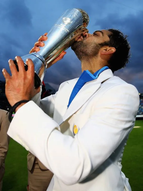 Virat-Kohli-with-champions-Trophy-2013